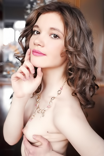 Touching herself and exposing her delicate body on the floor