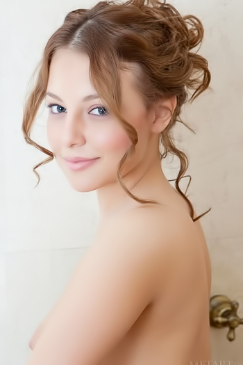 Shy red head barely legal babe undresses at the bathroom