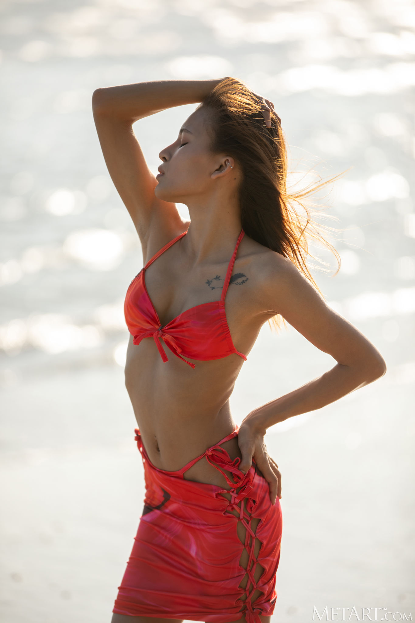 Oopeve Sprawls On The Sand In A Playful Bikini Striptease